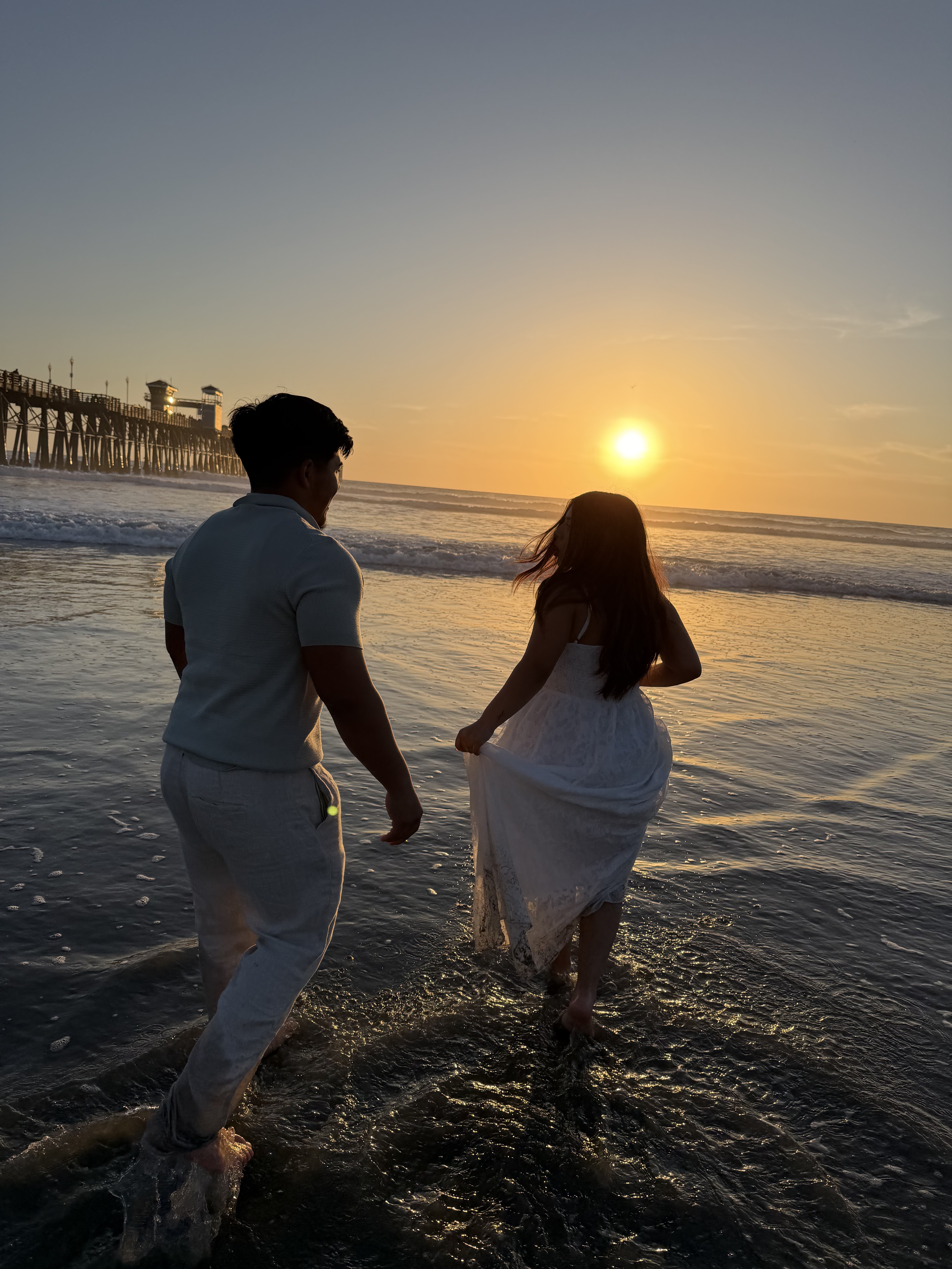 Kassandra and Jacob walking together at the beach